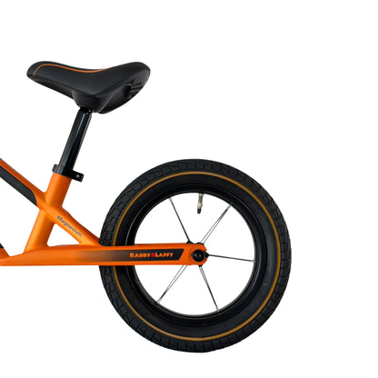 Berlin Bike Raddy Laffy Balance Bike 12 Inch rear wheel and saddle detail orange