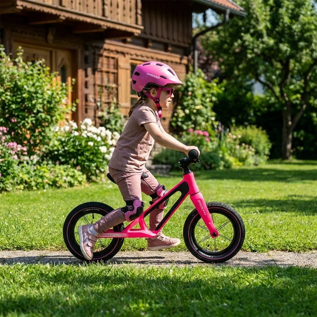 Berlin Bike Raddy Laff Balance Bike 12 Inch child riding outdoors pink